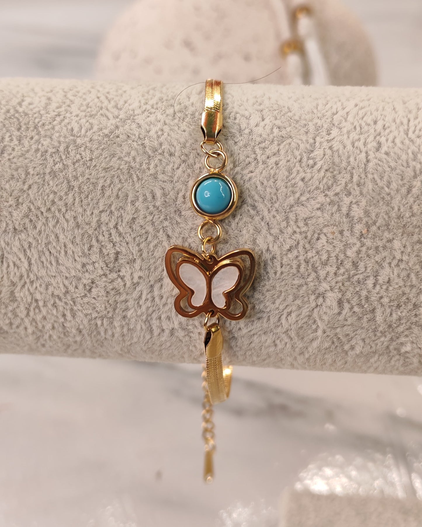 Gold Bracelet with Butterfly and Blue Stone