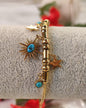 Gold Bracelet with Stars and Blue Stones