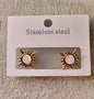 White stone sun earrings